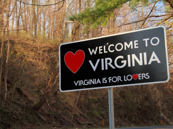 a roadside sign welcomes travelers into virginia